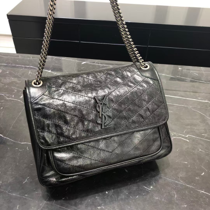 Flip bag, the YSL logo covered with leather